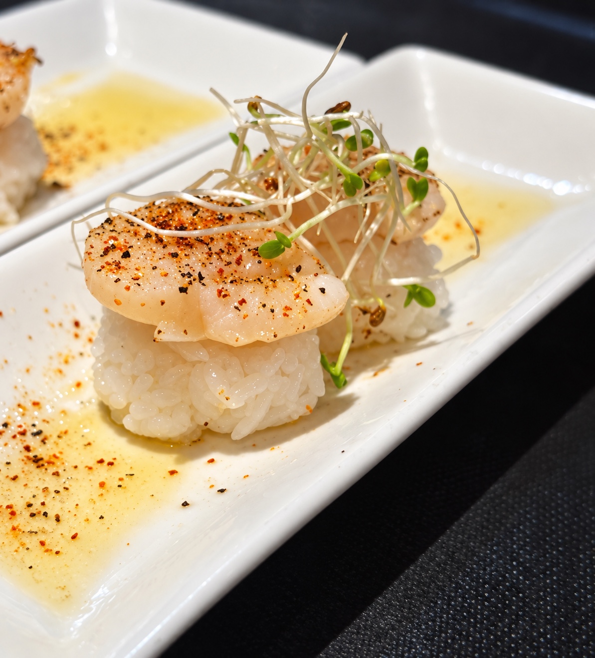 Eastwind scallop nigiri with sprouts